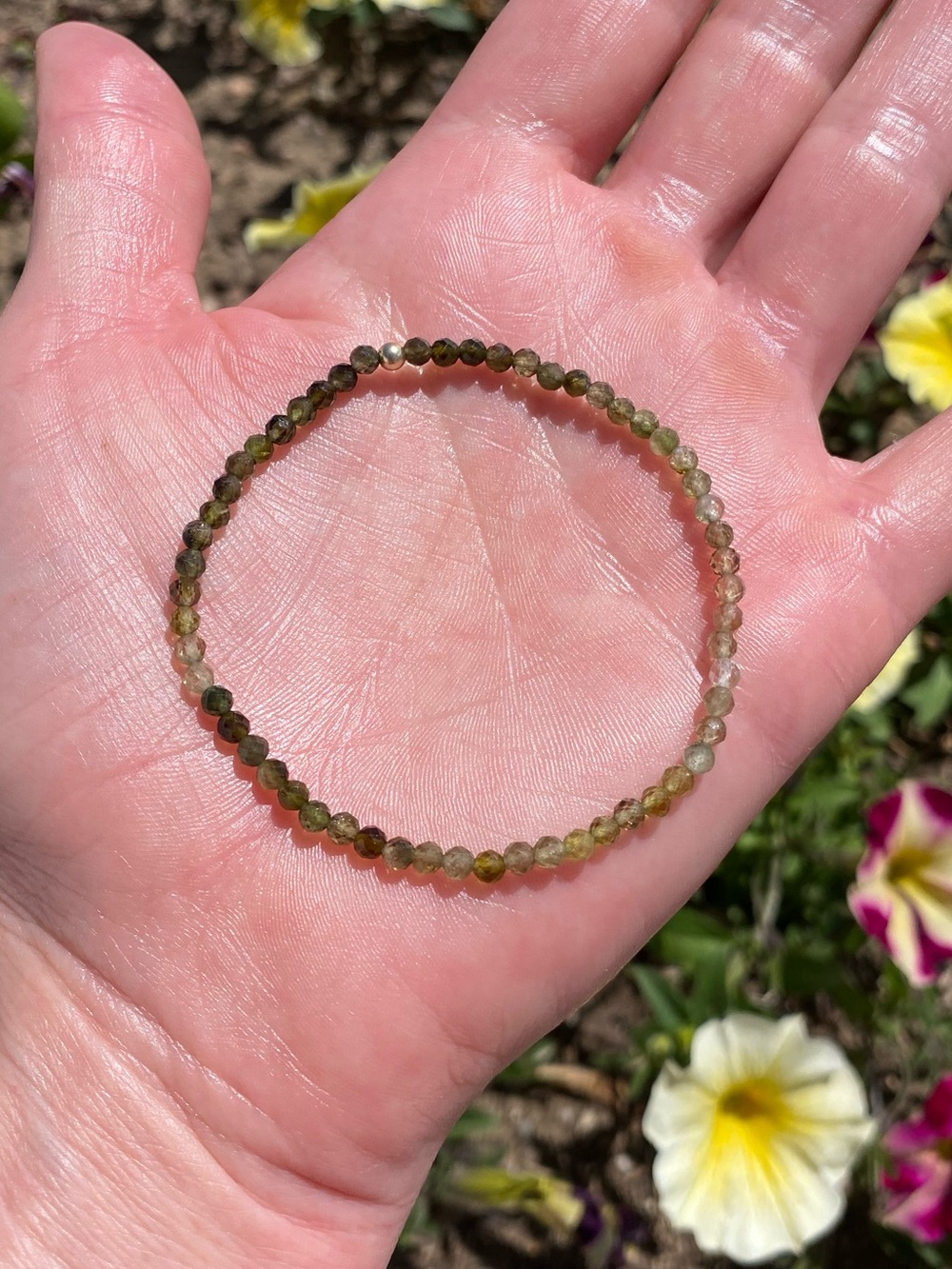 Faceted tourmaline bead bracelet with 14k yellow gold knot ball